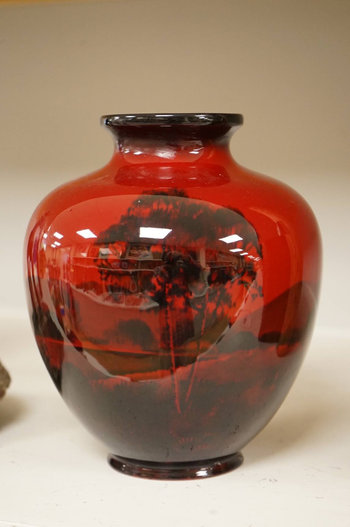 A Royal Doulton flambé vase decorated with a landscape, 19cm high